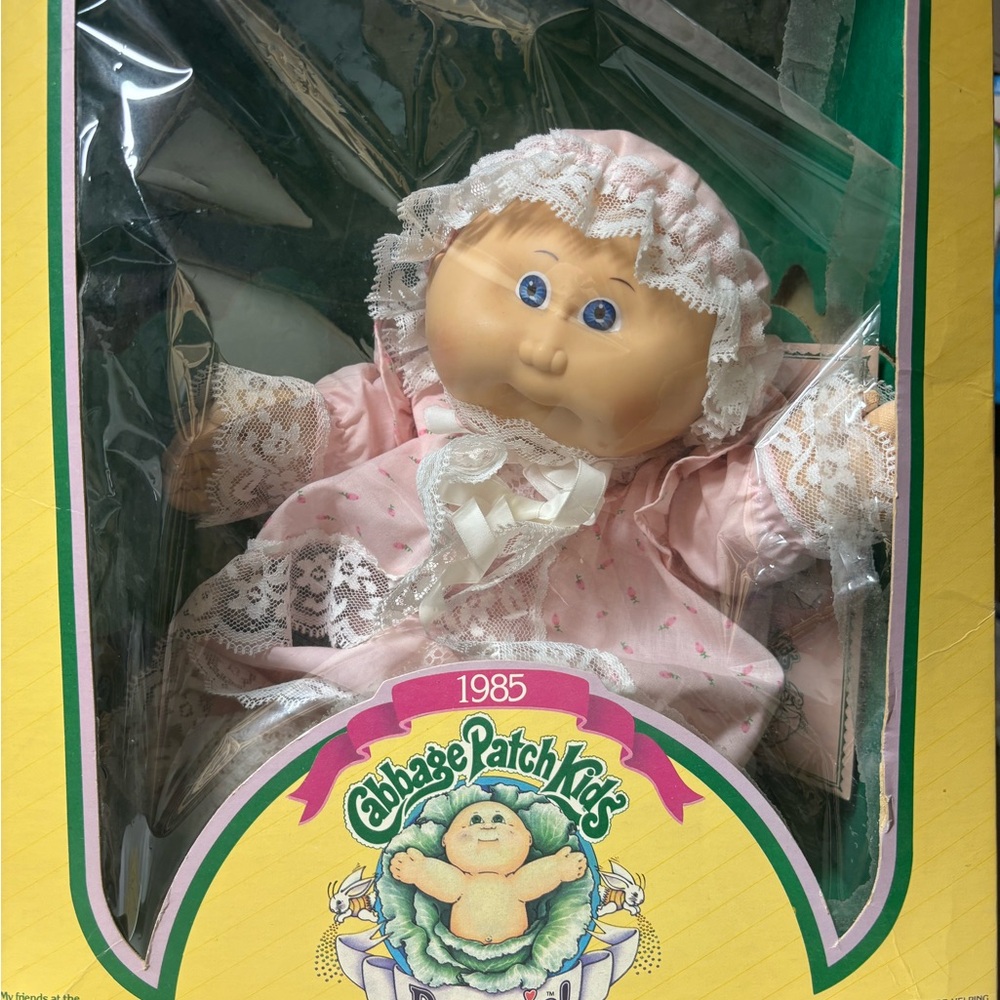 4 vintage Cabbage Patch Kids in original packaging.